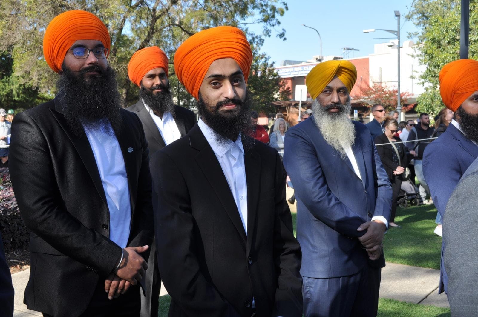 Close portrait of AKA members at a community event